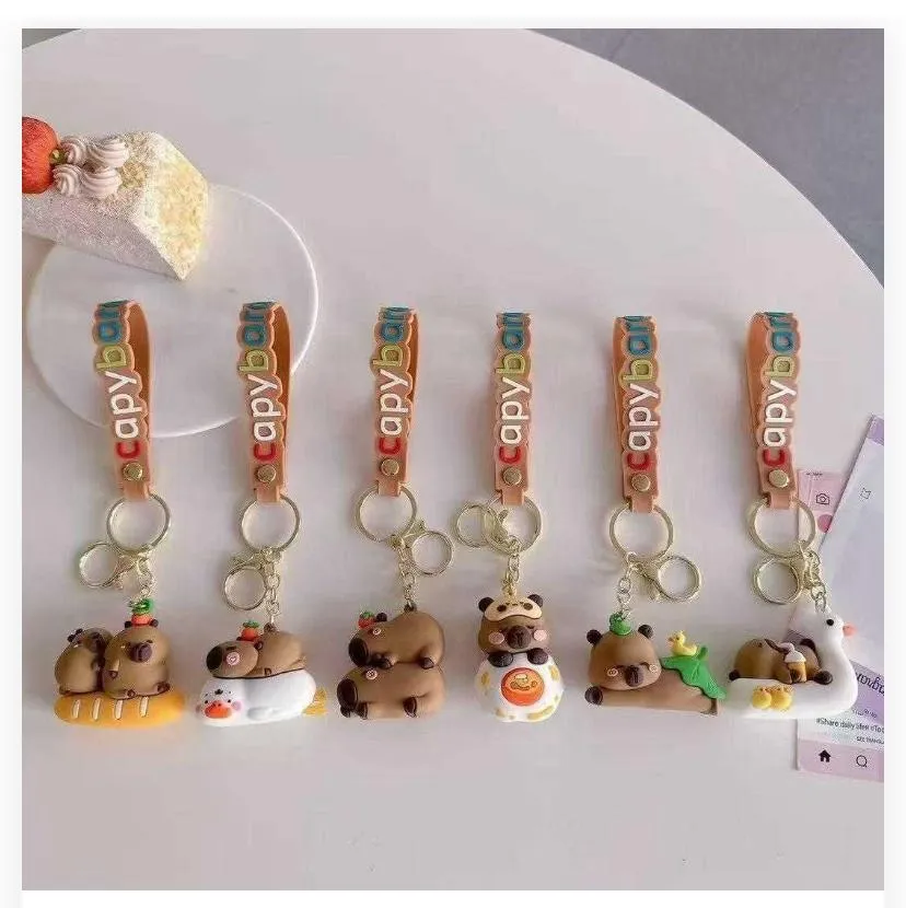 787899 Quirky Lounging & Riding Capybara Silicone Keychain Collection