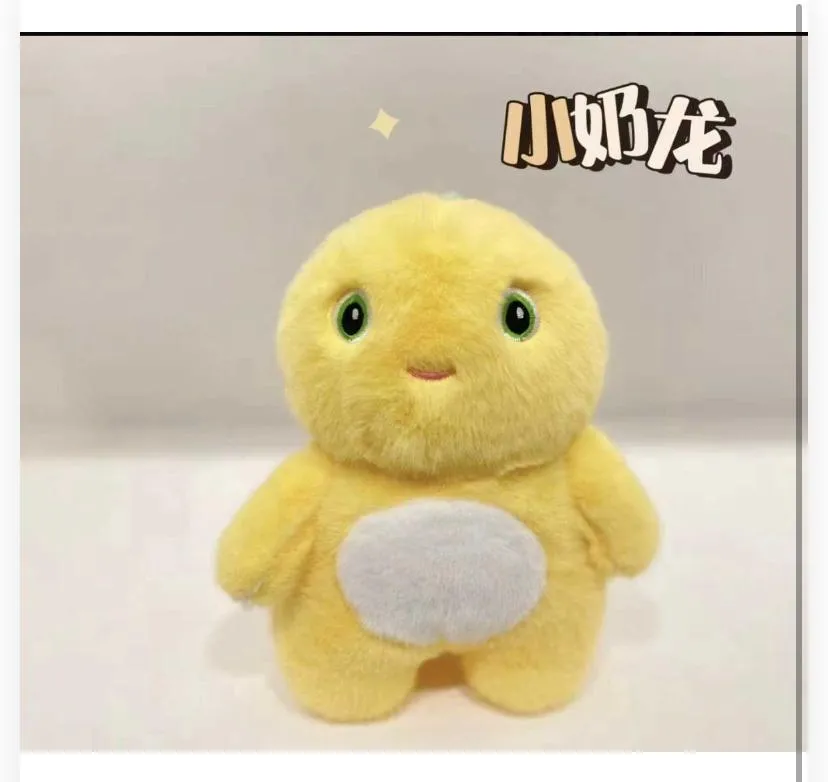 A cute, chubby plushie with soft bright-yellow fur, a white oval patch on its belly, large expressive green eyes, and a small subtle smile line