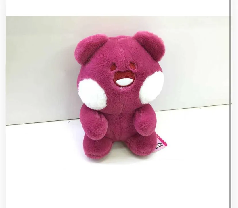 seated bear plush toy with stylized, expressive facial features.