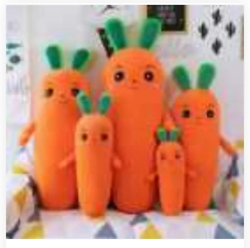 five carrot-themed plush pillows standing in varying sizes against a bright indoor background.