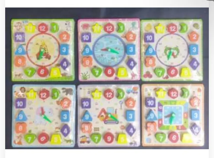 ombines time-telling practice with shape recognition and color matching. Features moveable clock hands and removable numbered geometric