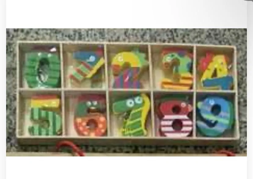 Features numbers 0 through 9 decorated with playful patterns, googly eyes, and bright multicolor designs to engage young learners.